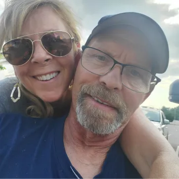 A photo of Greg and his wife. 