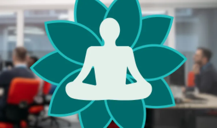 a person looking relaxed and calm in a busy office setting.