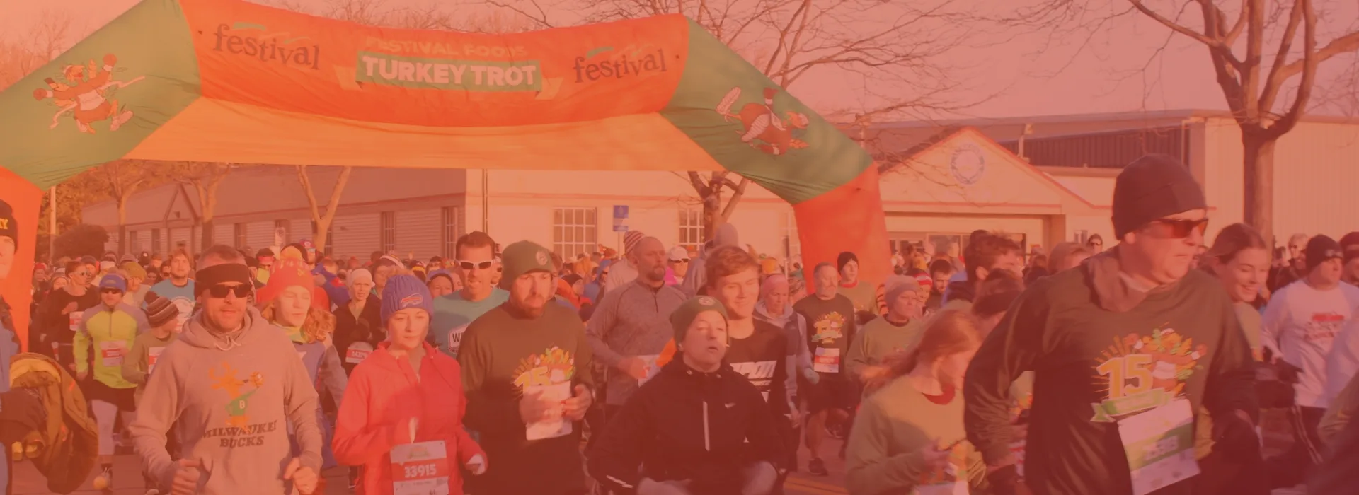 a group of runners at the turkey trot.